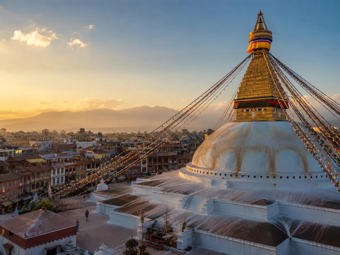 Boudhanath Stupa at sunset with the Kathmandu skyline, Nepal